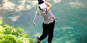 a person holding a golf club