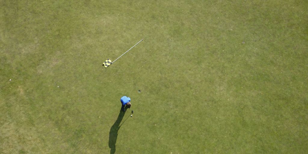 aerial photo of man playing golf