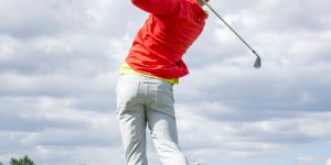 man in red long-sleeved top golf